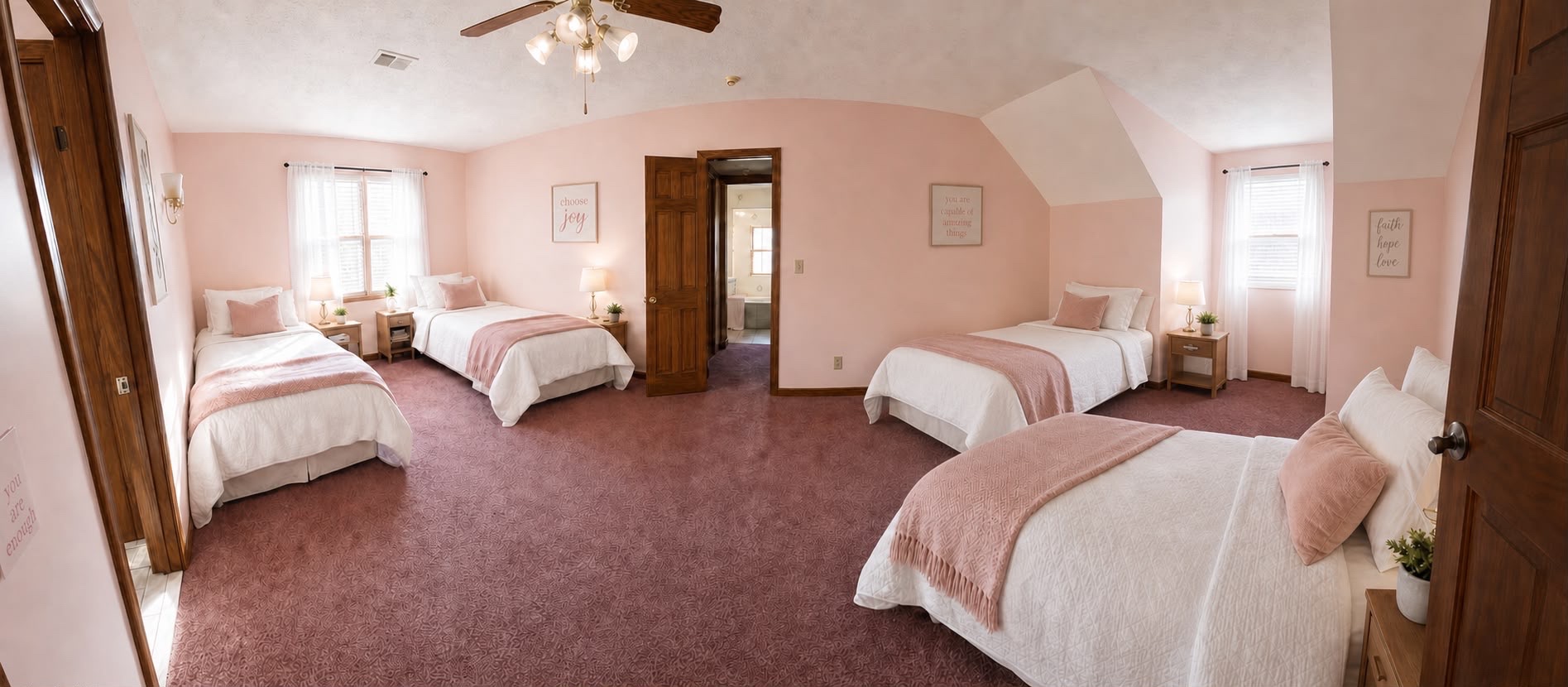 Pink bedroom with 4 full-size beds, soft pink walls, mauve carpet and motivational décor